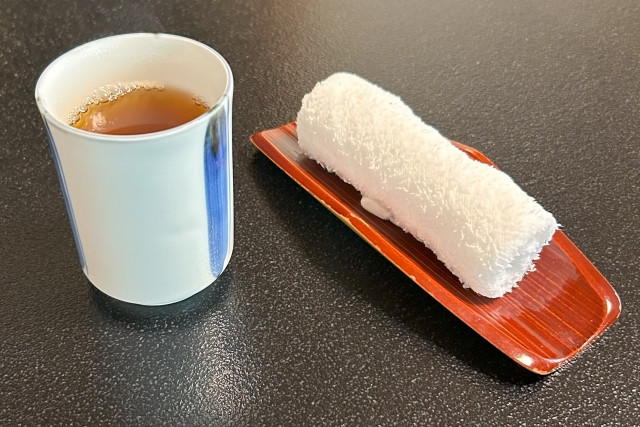 warm tea and warm towel (oshibori) at a japanese restaurant